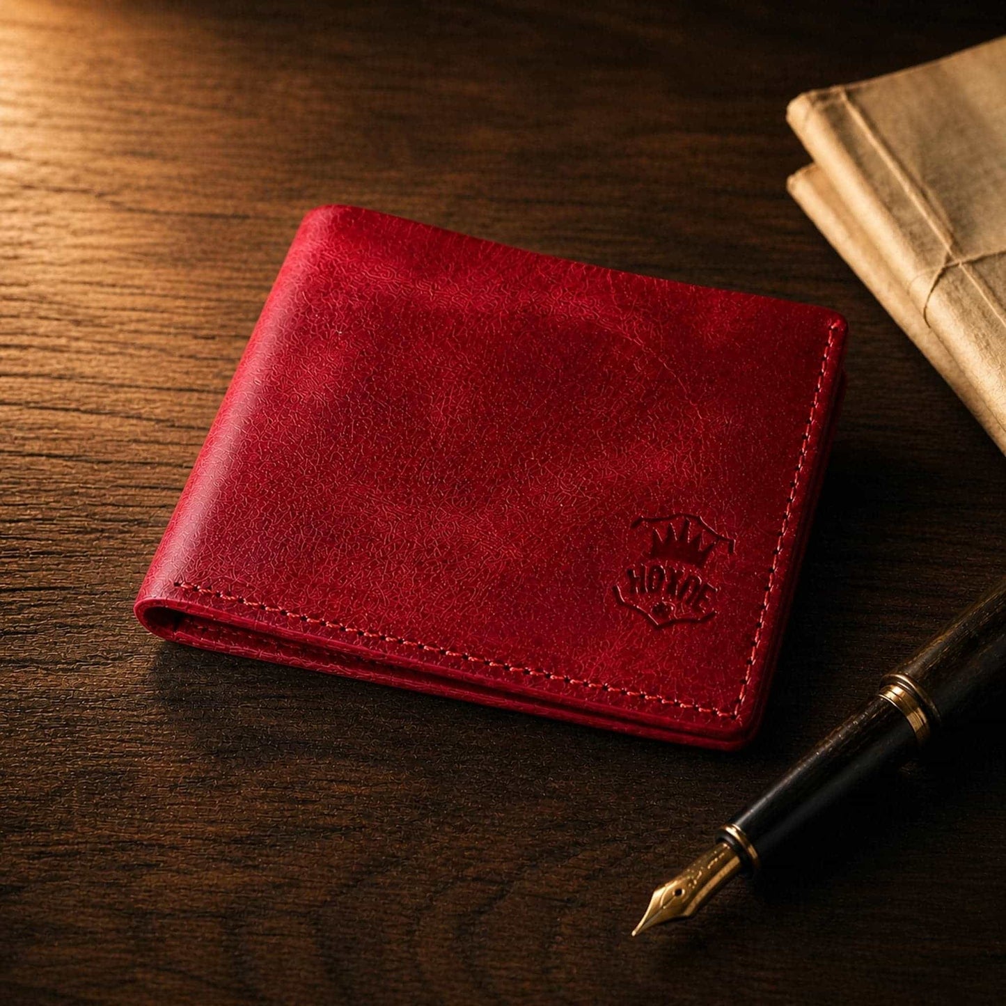Hoxne Leather bifold wallet in red, lifestyle photo