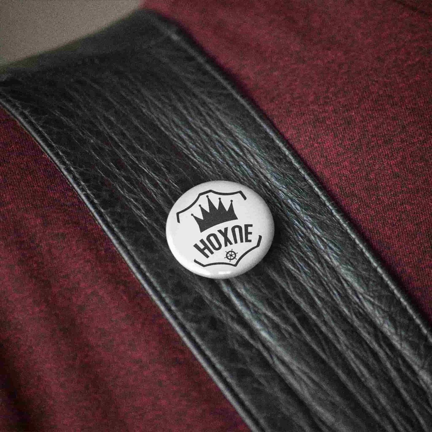 Hoxne Leather brand badge on a full-grain leather strap — handcrafted leather goods